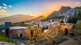 Fototapeta  - The Ruins of Taormina Theater at Sunset. Beautiful travel photo, colorful image of Sicily.