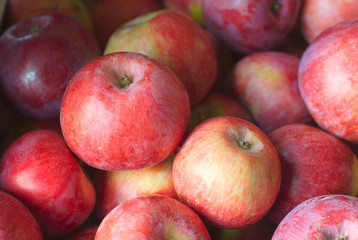 red apples fruits stack at the market