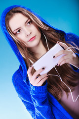 Wall Mural - young woman with smart phone listening music