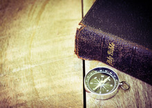 Conceptual Image Of The Compass  And Holy Bible  On Wooden Background