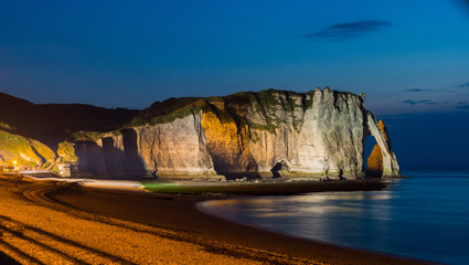 White cliffs and beach of Etretat lighted at night