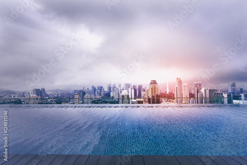 Obraz na plátne Swimming pool on roof top with beautiful city view