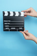 © Myvisuals - movie clapper on blue background, cinema concept