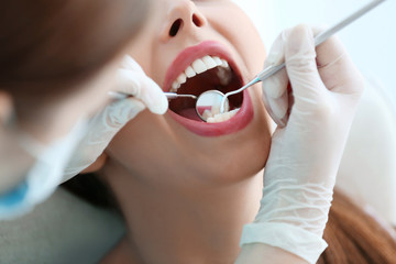 Sticker - Dentist examining patient's teeth, close up