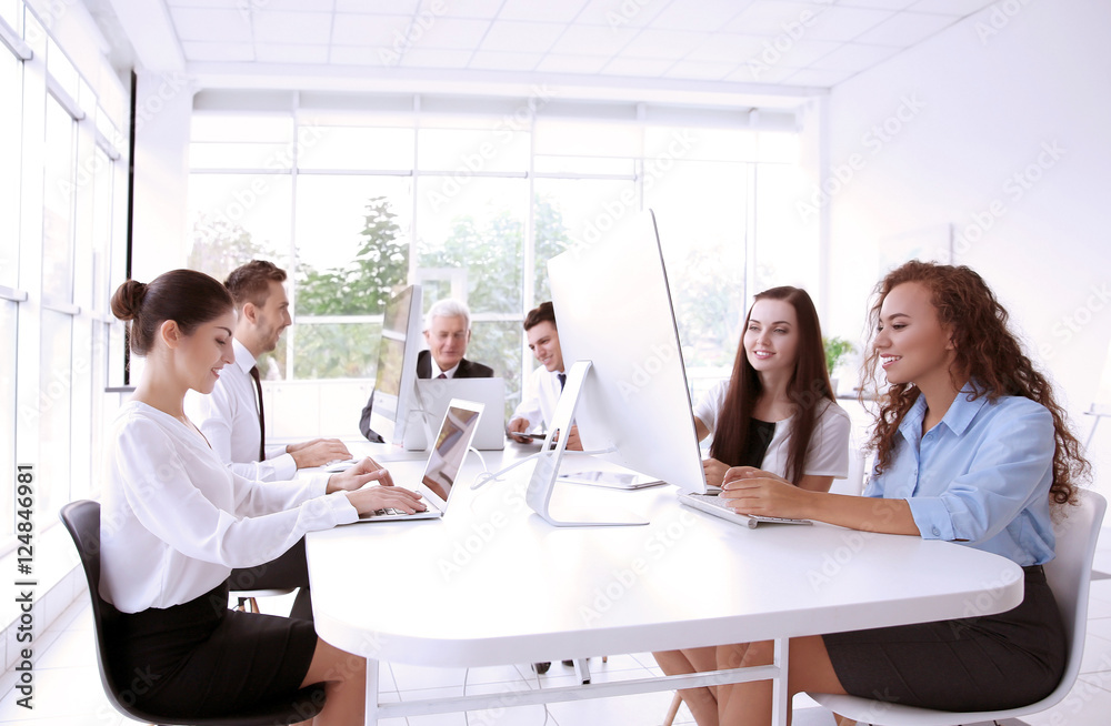 Business training concept. Colleagues working on computers at office