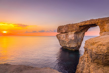 Panoramic View Of Amazing Sunset Over The Sea Near Azure Window Using As Wallpaper Or Nature Background, Gozo, Malta