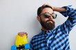 © kegfire - bearded hipster in casual blue shirt with skateboard