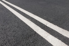Double White Line Diagonally Across The Road