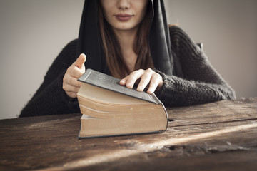 Muslim woman reading holy islamic book koran