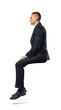 © gearstd - Businessman in profile in sitting position isolated on the white background.