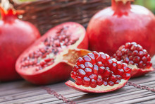 Ripe Pomegranate Fruit On Wooden Background