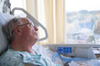 © Mat Hayward - Old man in hospital bed looking up