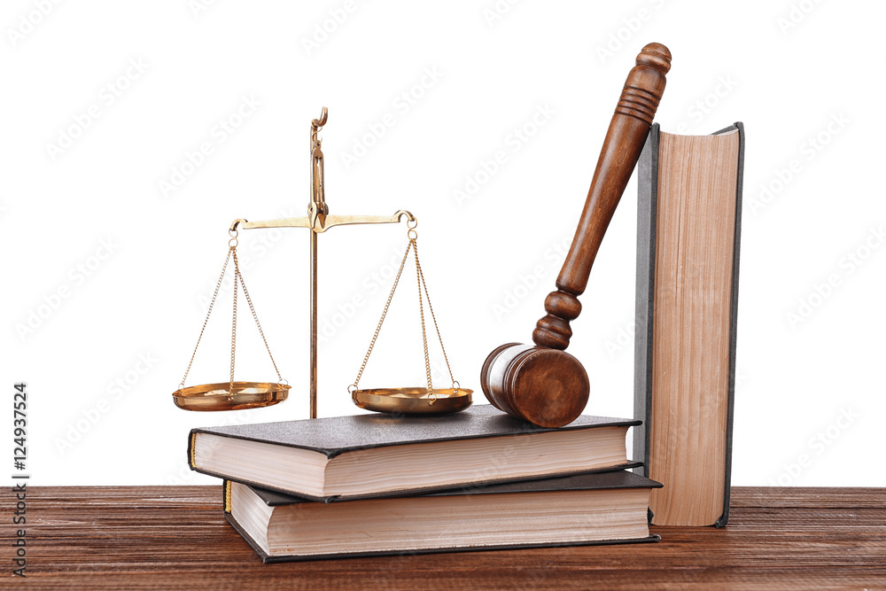 Gavel with books and scales on white background
