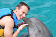 dolphin kiss man