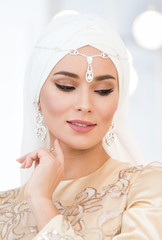 beautiful bride in white traditional muslim dress