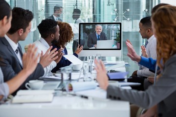Poster - Business people looking at a screen during a video conference