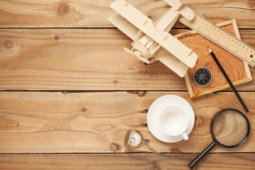 Empty coffee cups,Wood airplane, compass,pocket watch,ruler 