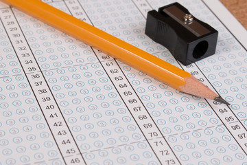 standard test form or answer sheet. answer sheet focus on pencil. bubble anser sheet with blank answ