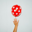 © aledesun - polka dot red/white balloon- direct flash used for contemporary trend