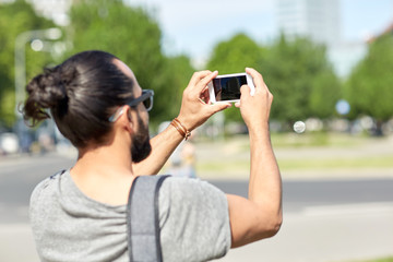 Sticker - hipster man taking picture on smartphone