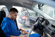 © Syda Productions - mechanic man with laptop making car diagnostic