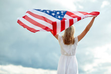 Happy Young Woman With American Flag Outdoors