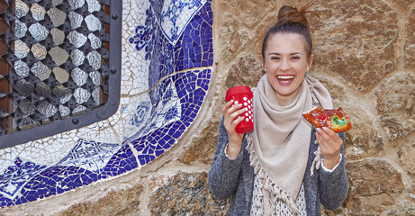 smiling tourist woman at Guell Park in Barcelona at Christmas