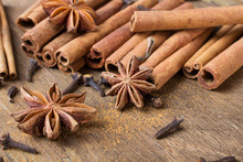 Cinnamon Sticks, Star Anise And Cloves On Wooden Background