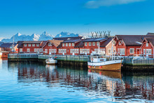 Typical Red Harbor Houses In Svolvaer At Early Morning. Svolvaer Is Located In Nordland County On The Island Of Austvagoya.