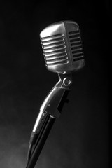 Vintage microphone on black background