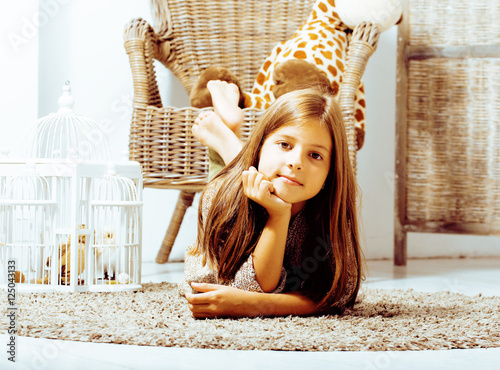 Poster little cute brunette girl at home interior happy smiling close u