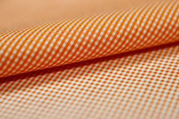 Wall Mural - close up roll orange and white scott pattern fabric of shirt