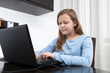 © dsneff - girl using a laptop