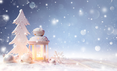 Wall Mural - white christmas decoration with lantern on snowy table and shiny snowfall