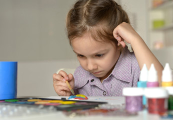 Wall Mural - little girl drawing at home