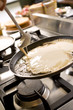 © Tjeerd - pancakes cooking on the hot stove griddle. Shallow depth of fiel