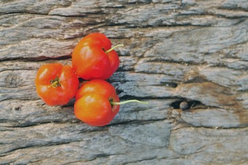 Acerola fruit on wood background