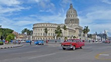 HAVANA, CUBA - OCTOBER 8, 2014: Old Classic American Cars On The Streets Of Havana City, Cuba.Capital Building.Urban Scene, People And Traffic