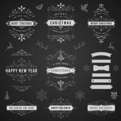 Wall Mural - vintage typographic labels and badges set with merry christmas and happy new year wishes on blackboa