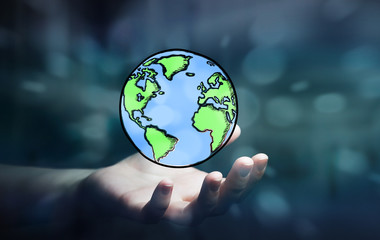 businesswoman holding hand drawn planet earth