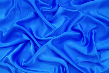 blue silk or blue satin textile fabric texture background