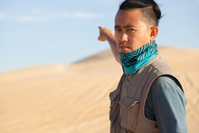 An Asian Male Tourist Travelling In Windy White Sand Dunes At Muine Desert, Phan Thiet, Vietnam