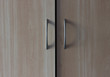 beige wooden wardrobe handle close up, horizontal