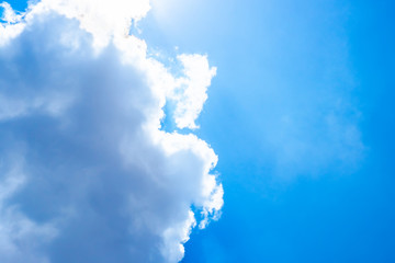 Wall Mural - sun beam behind cloudy with blue sky,nature background