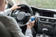 Man using a smartphone and driving
