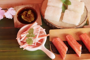 Sticker - Crab stick with wasabi sauce and making sushi.