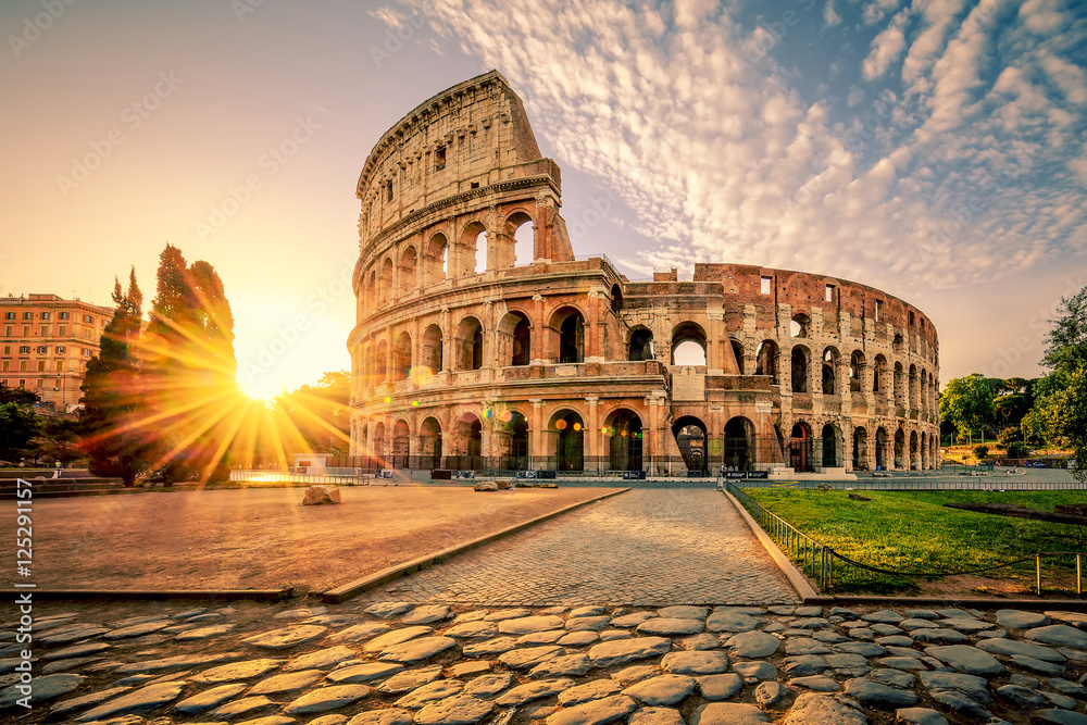 Colosseum in Rome and morning sun, Italy - obrazy, fototapety, plakaty 