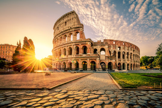 colosseum in rome and morning sun, italy