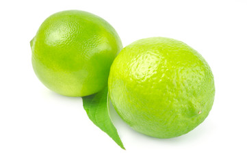 Two lime with leaf on white background