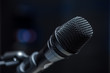Close-up of microphone in  conference room or concert hall.